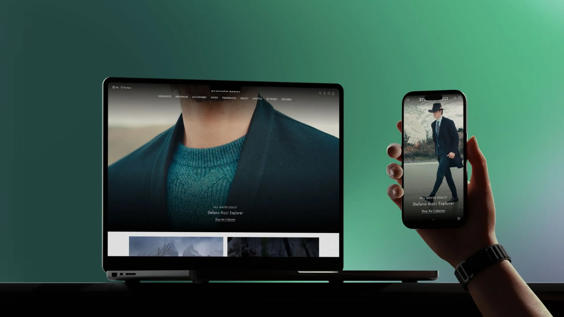 Laptop e smartphone tenuto in mano con la home di Stefano Ricci Explorer, collezione Fall Winter 2026–27